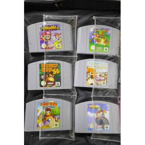 403 - A collection of 90s video game items to include six N64 cartridges - 'Super Smash Brothers', 'Super ... 