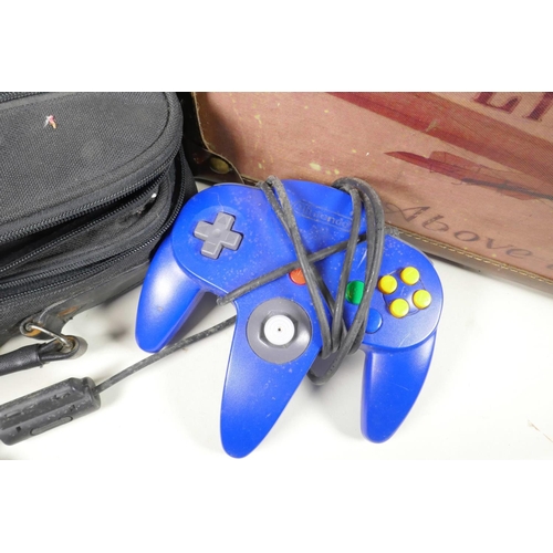 403 - A collection of 90s video game items to include six N64 cartridges - 'Super Smash Brothers', 'Super ... 