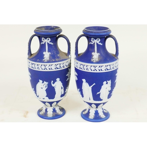 409 - A pair of C19th Wedgwood Jasperware two handled pedestal vases decorated with Grecian figures, 6