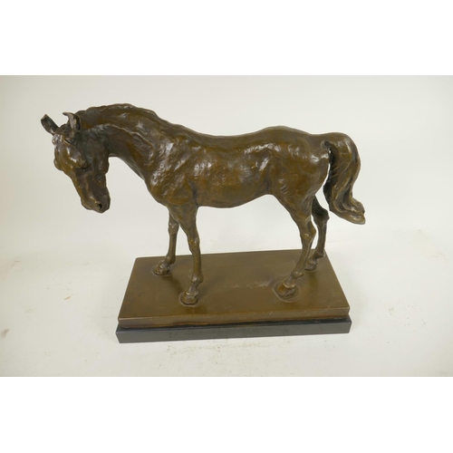 412 - A bronze figure of a horse after Mene on a bronze and marble plinth, 12