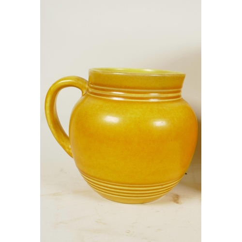 418 - A yellow glazed Bretby Pottery baluster vase with ring turned neck, 8¾