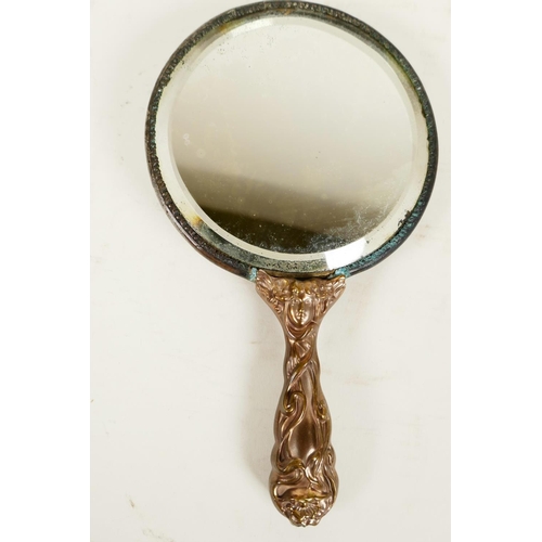 419 - A C19th Art Nouveau bronze hand mirror embossed with scrolls and faces, and bejewelled glass mirror,... 