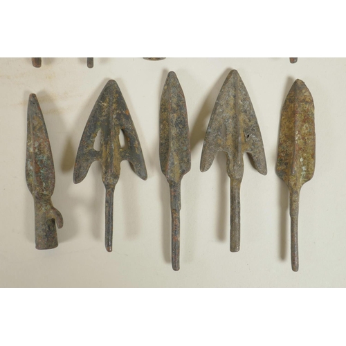 423 - A collection of ten archaic bronze arrowheads, 3½