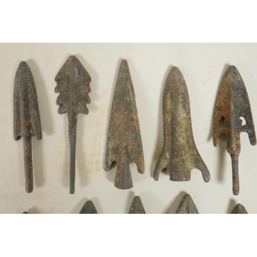 423 - A collection of ten archaic bronze arrowheads, 3½