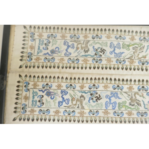 426 - A Chinese silk embroidery depicting cranes and bats, 22