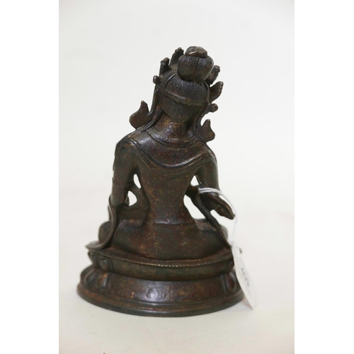 428 - A Bronze Buddhistic figure, seated upon a lotus throne, with distressed gilt decoration, 7