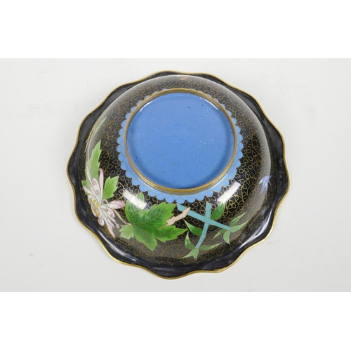 442 - A Chinese black ground cloisonne bowl with frilled rim and chrysanthemum decoration, 8½