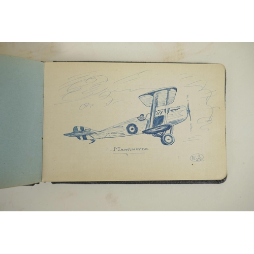 447 - An early C20th autograph book containing portrait paintings, sketches and poems