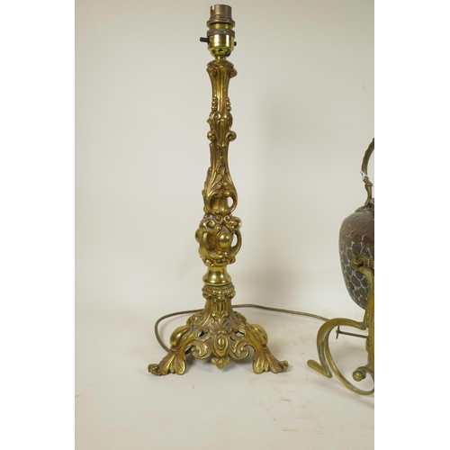 449 - A pair of bronzed metal lamps on triform bases with gadrooned and swag moulded decoration, together ... 