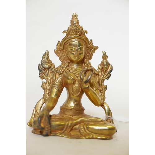 456 - A solid cast gilt bronze figure of Buddha, 4½