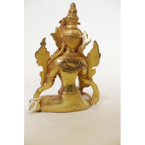 456 - A solid cast gilt bronze figure of Buddha, 4½