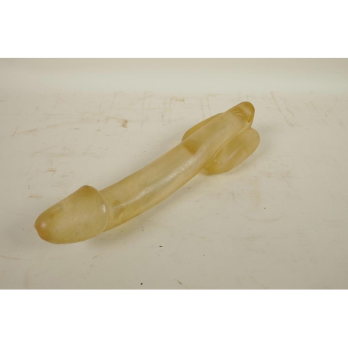 463 - A large moulded glass phallic ornament, 11