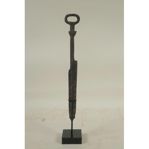 465 - A Chinese bronzed metal dagger, on a display mount, 12