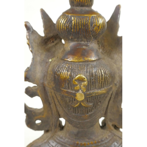 47 - A Chinese bronze figure of a Buddhist deity seated in meditation, 8