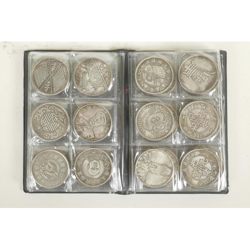 48 - A wallet of Chinese facsimile (replica) white metal coins, sixty total, 1½