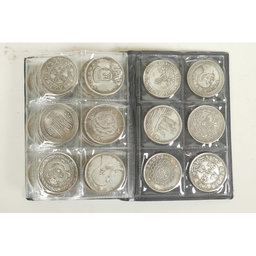 48 - A wallet of Chinese facsimile (replica) white metal coins, sixty total, 1½