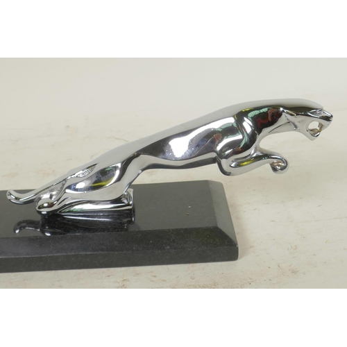 51 - A desk top chrome plated paperweight in the form of a Jaguar car mascot, 7½