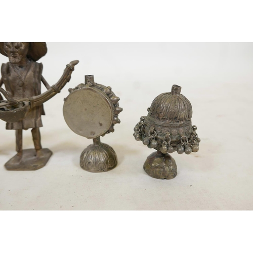 52 - Two Oriental naive bronze figures, together with two Tibetan white metal vessels and a small bronze ... 