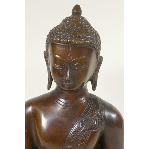 54 - A cast brass figure of Shakyamuni Buddha seated in meditation, 12