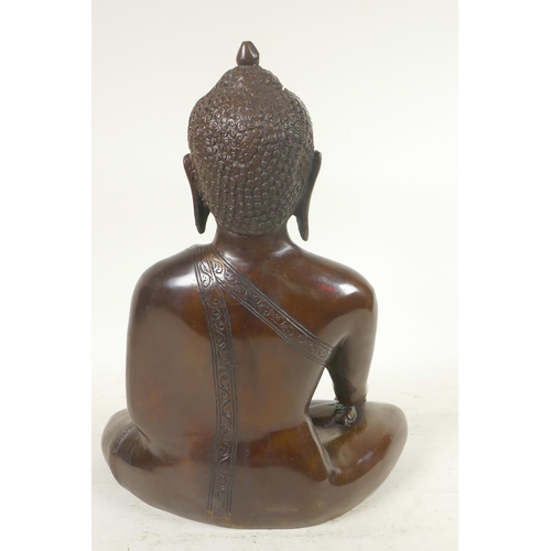 54 - A cast brass figure of Shakyamuni Buddha seated in meditation, 12