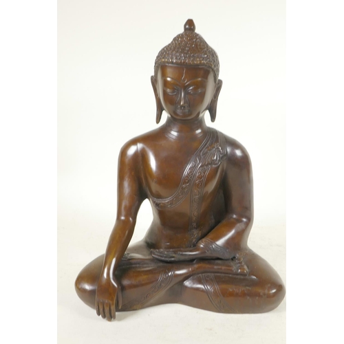 54 - A cast brass figure of Shakyamuni Buddha seated in meditation, 12