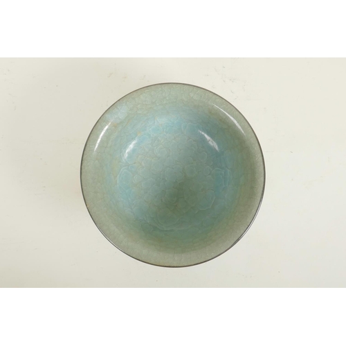 60 - A Chinese celadon crackle glazed porcelain bowl, raised seal mark to base, 8½