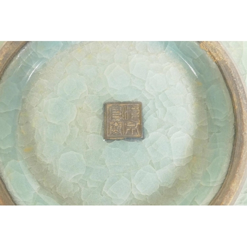 60 - A Chinese celadon crackle glazed porcelain bowl, raised seal mark to base, 8½