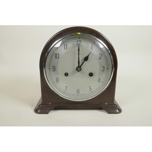 606 - A mid C20th Smith's Enfield chiming mantel clock, dark wood effect bakelite casing and silver dial, ... 