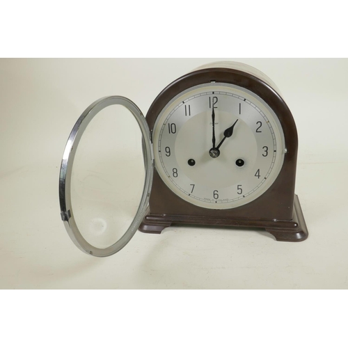 606 - A mid C20th Smith's Enfield chiming mantel clock, dark wood effect bakelite casing and silver dial, ... 