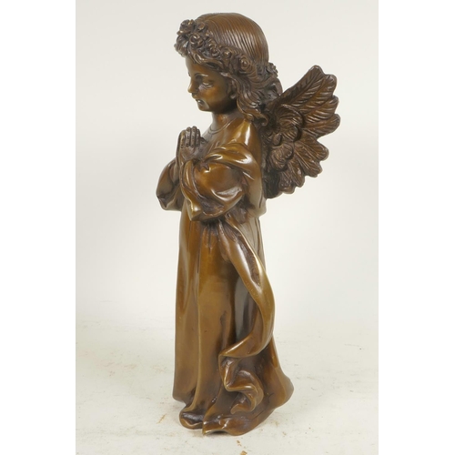 61 - A cast bronze figure of a praying angel, 12