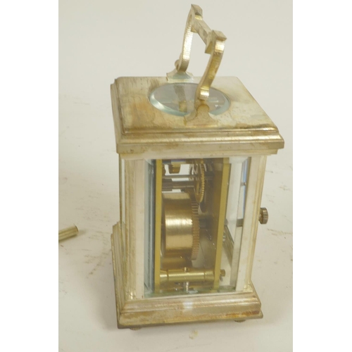 612 - A silver plated carriage clock with white enamelled dial and Roman numerals, comes with key, 3¼