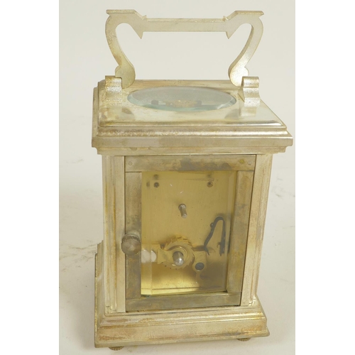 612 - A silver plated carriage clock with white enamelled dial and Roman numerals, comes with key, 3¼