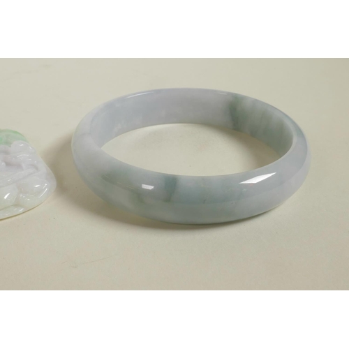 618 - A Chinese marbled green jade bangle, and a carved jade pendant with dragon tortoise decoration, bang... 