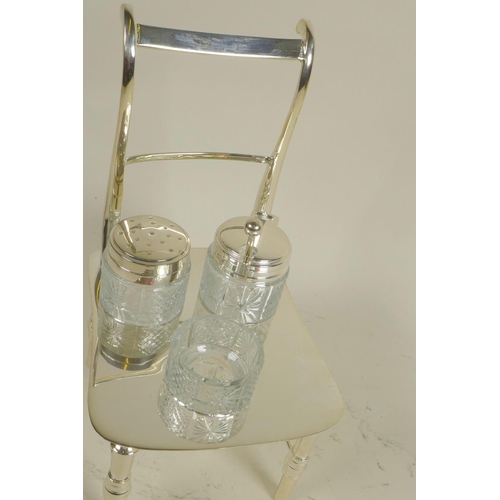 619 - A silver plated cruet, the stand in the form of a bar back chair, 8