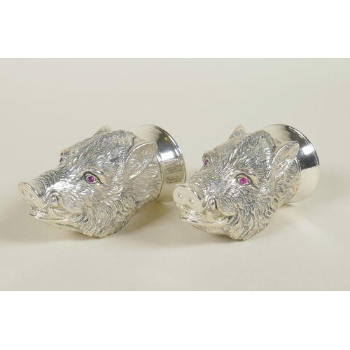 632 - A pair of silver plated salt and pepper cruets in the form of boars' heads, 2