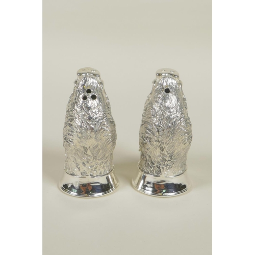 632 - A pair of silver plated salt and pepper cruets in the form of boars' heads, 2