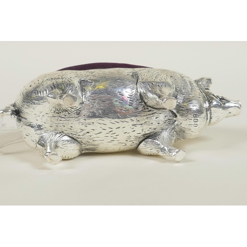 637 - A silver plated pincushion in the form of a pig, stamped 800, 4