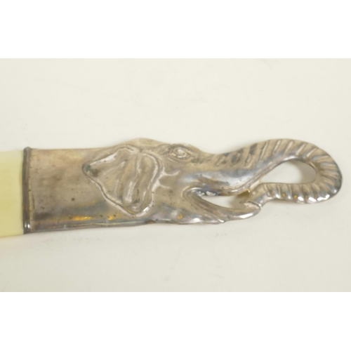 638 - A bone letter opener with silver plated elephant's head handle, 10½