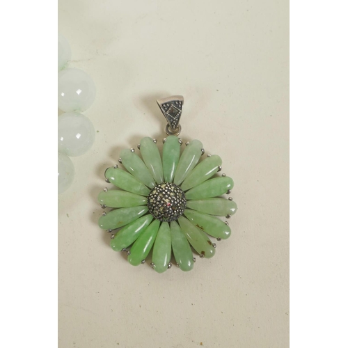 644 - A 925 silver daisy shaped pendant set with green jade and marcasite, together with two jade beaded b... 