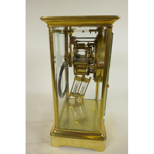 650 - A Tiffany brass cased four glass mantel clock with exposed Brocot escapement and mercury pendulum, t... 