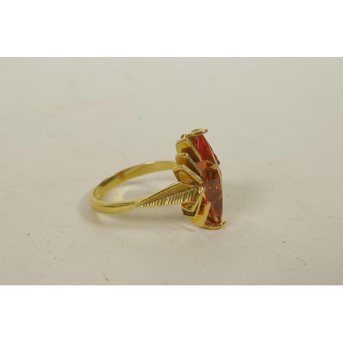 653 - An untested 18ct yellow gold Art Deco style ring set with a synthetic orange sapphire, approximate s... 