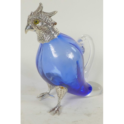 667 - A blue glass decanter with silver plated head, legs and feet in the form of a parrot, 6½