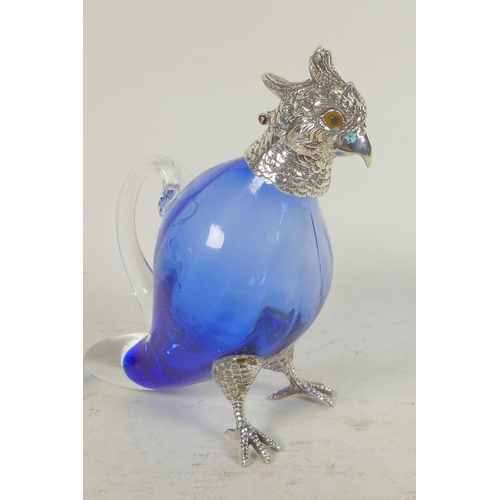 667 - A blue glass decanter with silver plated head, legs and feet in the form of a parrot, 6½