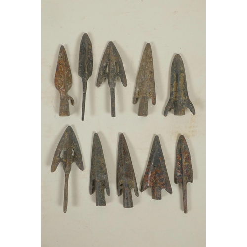 67 - A collection of ten archaic bronze arrowheads, 3½