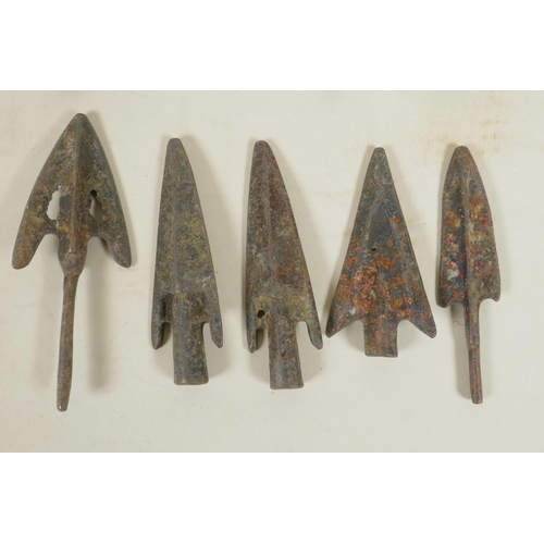 67 - A collection of ten archaic bronze arrowheads, 3½