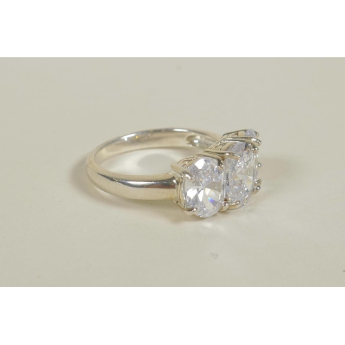 674 - A 925 silver and cubic zirconium three stone ring, approximate size 'O/P'