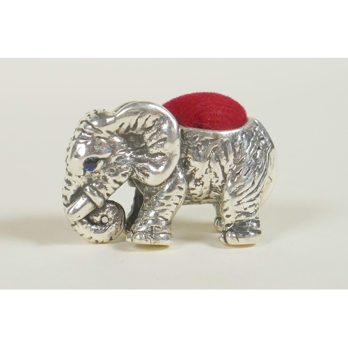 686 - A sterling silver pincushion in the form of an elephant, 1½