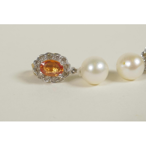 694 - A pair of 9ct gold earrings set with an orange topaz encircled by diamonds, and pearl drop