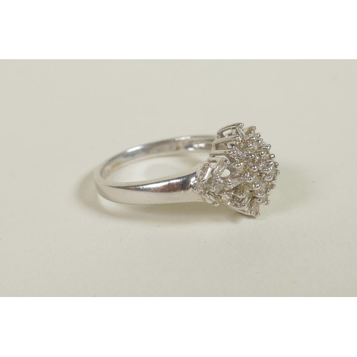 700 - A 9ct white gold diamond cluster ring, approximate size 'M'