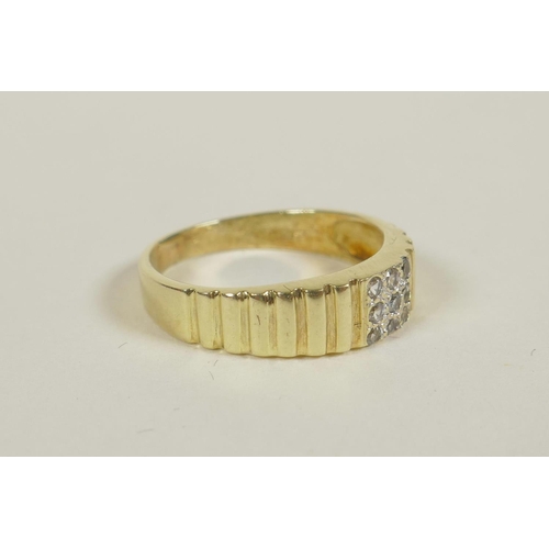 701 - A ribbed yellow gold and diamond set ring, approximate size 'L'